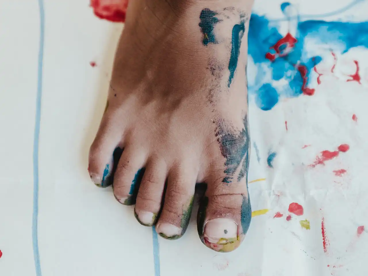 Children foot with paint